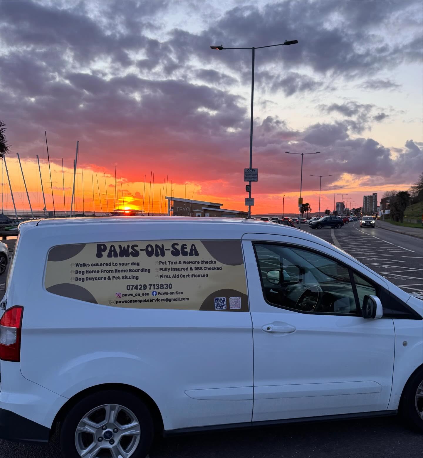 The Paws-on-Sea van by the seafront at sunset